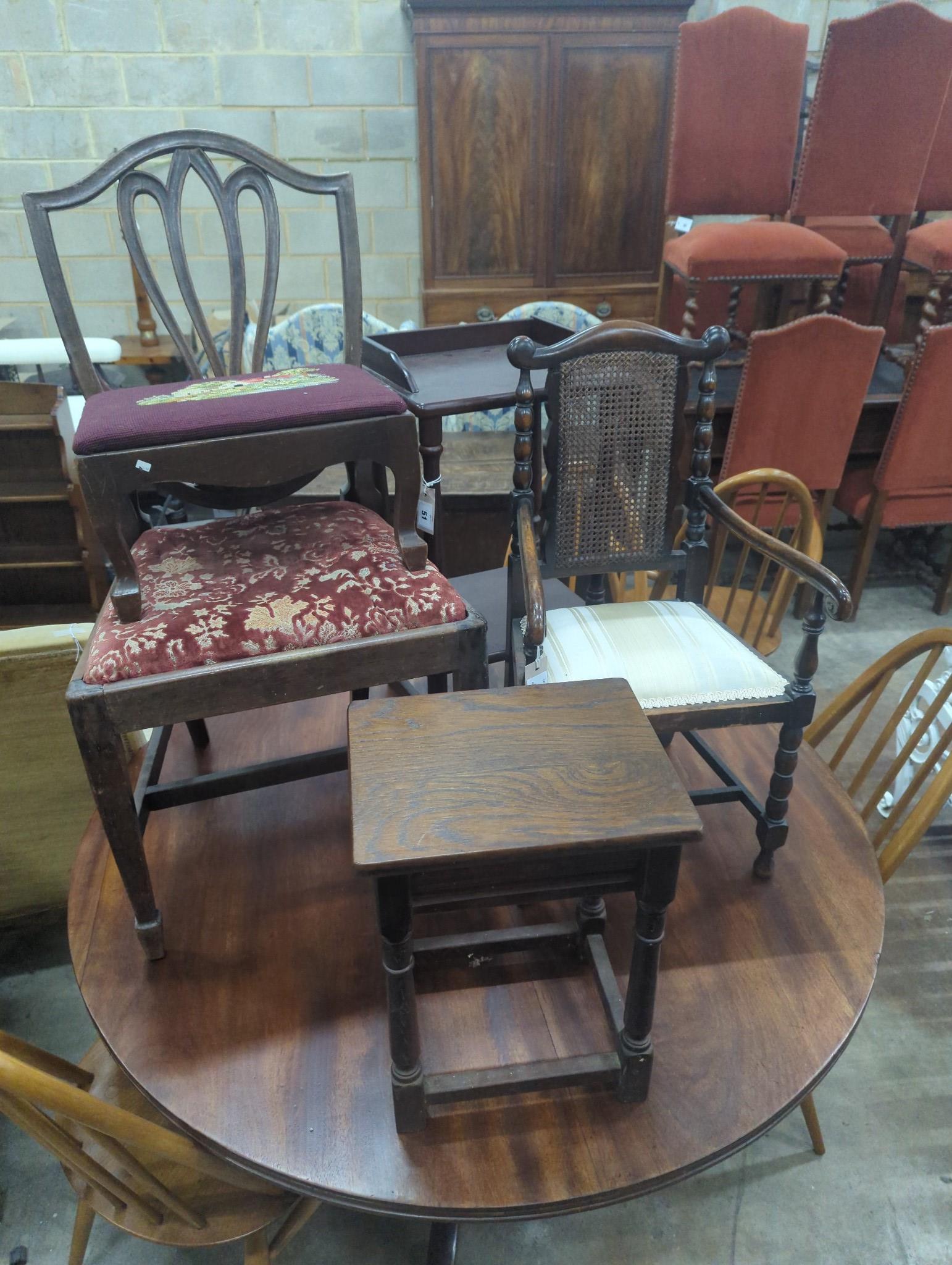 An early 20th century caned beech child's elbow chair, a George III dining chair, two stools and a Victorian style mahogany two tier table, width 36cm height 63cm